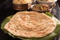 Hot Parotta on banana leaf with biryani ,Paneer Butter Masala and fried rice. Royalty Free Stock Photo