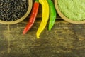 Hot peppers of different colors, black pepper and garlic Royalty Free Stock Photo