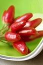 Hot peppers in a green cup