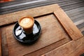 Hot piccolo latte served on table