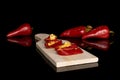 Hot pickled pepper isolated on black glass Royalty Free Stock Photo