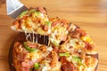 Hot pizza dip tray of pizza toppings include ham, pork, paprika and vegetables, pizza, Italian food saurian. View from side Royalty Free Stock Photo