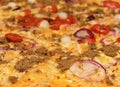 Hot pizza with melting cheese close up. Cheeze pizza. Close up photo. Macro photo of baked pizza ingredients - cheese with ham, on Royalty Free Stock Photo