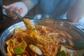 Hot pot of budae jjigae, korean instant noodles (ramyeon), pork, sausage, mussels and vegetables Royalty Free Stock Photo