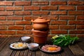 Hot pot with clear soup in the clay cooking pot. Royalty Free Stock Photo