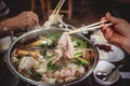 Hot pot with clear soup, Pork, fish, vegetables, blanched in hot broth and dipped in a variety of sauces Royalty Free Stock Photo