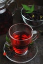 Hot raspberry tea and black raspberries in glass bowl Royalty Free Stock Photo