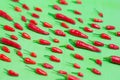 Hot red chillies on a green background. colors. colorful background
