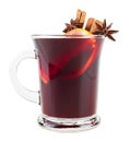 Hot red mulled wine in glass isolated on white background. Mulled wine with christmas spices, orange slice, anise and cinnamon Royalty Free Stock Photo