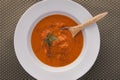 Hot red pepper soup with a spoon in it. Royalty Free Stock Photo