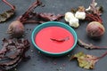 Hot rich fresh borscht, beet soup. Plate of red beetroot soup borscht on black rustic table.