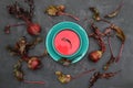 Hot rich fresh borscht, beet soup. Plate of red beetroot soup borscht on black rustic table.