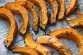 Hot roasted slices pumpkin with thyme, olive oil and salt on baking paper. Tasty vegan food