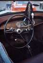 Hot Rod Retro car Cockpit parked in the old street of the European city Royalty Free Stock Photo