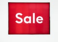 Hot Sale. Red bright sale banner at retail shopping mall entrance. Seasonal discount offer in store. Shop With Sale Sign Royalty Free Stock Photo