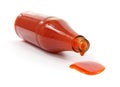 Hot sauce spilling from bottle Royalty Free Stock Photo