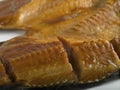 Hot smoked carp on a white background