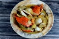 Hot soup meal of various fresh seafood marine crabs, shrimps, clams, mussels, gandofli, oysters, crab sticks, calamari, squid and