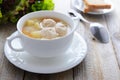 Hot soup with meatballs in white bowl Royalty Free Stock Photo