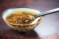 hot and sour soup in a traditional chinese soup spoon Royalty Free Stock Photo