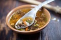 hot and sour soup in a traditional chinese soup spoon Royalty Free Stock Photo