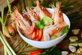 Hot and sour spicy shrimps prawns soup curry lemon lime galangal red chili straw mushroom on table food, Shrimp soup on seafood Royalty Free Stock Photo