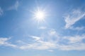 Sparkle sun on blue cloudy sky background Royalty Free Stock Photo