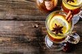 Hot spiced Apple cider Toddy with lemon, honey and cinnamon stick in glass Royalty Free Stock Photo