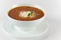 Hot and spicy beef soup with cheese in a bowl