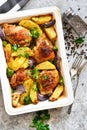 Hot spicy chicken with potatoes and broccoli baked. Concrete background. View from above Royalty Free Stock Photo