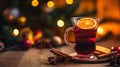 Hot spicy Christmas gluhwein, or mulled red wine with sugar and spices, served with cookies on rustic wood with a Royalty Free Stock Photo