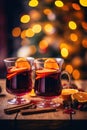 Hot spicy Christmas gluhwein, or mulled red wine with sugar and spices, served with cookies on rustic wood with a Royalty Free Stock Photo