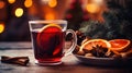 Hot spicy Christmas gluhwein, or mulled red wine with sugar and spices, served with cookies on rustic wood with a Royalty Free Stock Photo