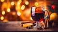 Hot spicy Christmas gluhwein, or mulled red wine with sugar and spices, served with cookies on rustic wood with a Royalty Free Stock Photo