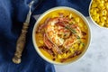 Hot spicy corn cream soup with bacon and shrimps. Royalty Free Stock Photo