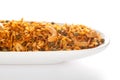 Hot spicy Kashmiri Mixture Namkeen snacks in a white ceramic oval bowl made with dry fruits, peanuts, corn flakes. Royalty Free Stock Photo