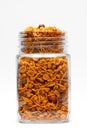Hot spicy Nav Ratan snacks in a glass jar, made with red chili, peanuts, corn flakes