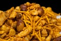 Hot spicy NavRatan mixture snacks in full-frame, made with, potato chips, peanuts, besan sev spicy snacks (Namkeen) Royalty Free Stock Photo