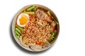 Hot and Spicy noodle in bowl and ingredients on isolated white background, Korea noodles with boil eggs, copy space and top view Royalty Free Stock Photo