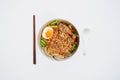 Hot and Spicy noodle in bowl and ingredients on isolated white background, Korea noodles with boil eggs in bowl with spoon and cho Royalty Free Stock Photo