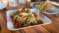 Hot and spicy papaya salad with pad thai, Thai style