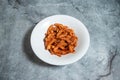 Hot Spicy pasta served in plate isolated on background top view of fast food Italian cousin Royalty Free Stock Photo