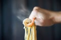 Hot and spicy spaghetti with shrimp and fork over black background Royalty Free Stock Photo