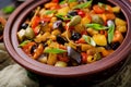 Hot spicy stew caponata eggplant, zucchini, sweet pepper, tomato, carrot, onion, olives Royalty Free Stock Photo