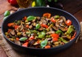 Hot spicy stew eggplant, sweet pepper, olives and capers. Royalty Free Stock Photo