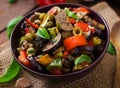 Hot spicy stew eggplant, sweet pepper, olives and capers Royalty Free Stock Photo