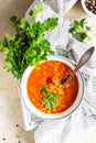 Hot and spicy, thick lentil and red bean soup with canned tomatoes and coriander. Concrete background