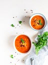 Hot and spicy, thick lentil and red bean soup with canned tomatoes and coriander. Concrete background, selective focus. Top view