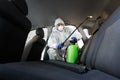 Hot steam disinfection of car seats in coronavirus hazmat Royalty Free Stock Photo