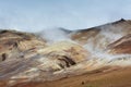 Hot steam raising above colored hills at Hverarond area, Iceland Royalty Free Stock Photo